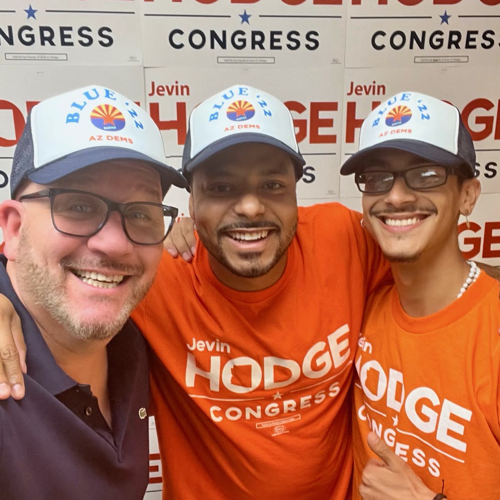 Blue Moreno with two people wearing Jevin Hodge campaign shirts and Arizona Democratic hats