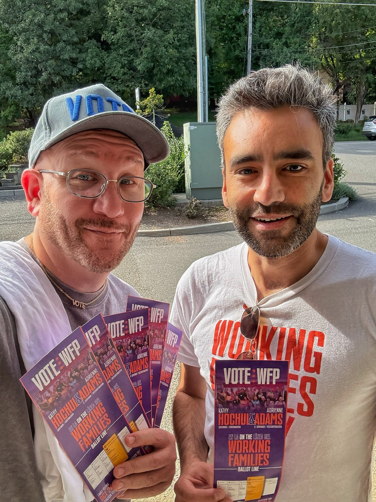 Blue Moreno and a man holding Working Families campaign literature outdoors in New York